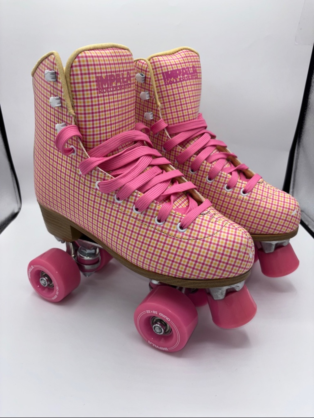 Impala Pink Plaid Quad Roller Skates with Hot Pink Laces